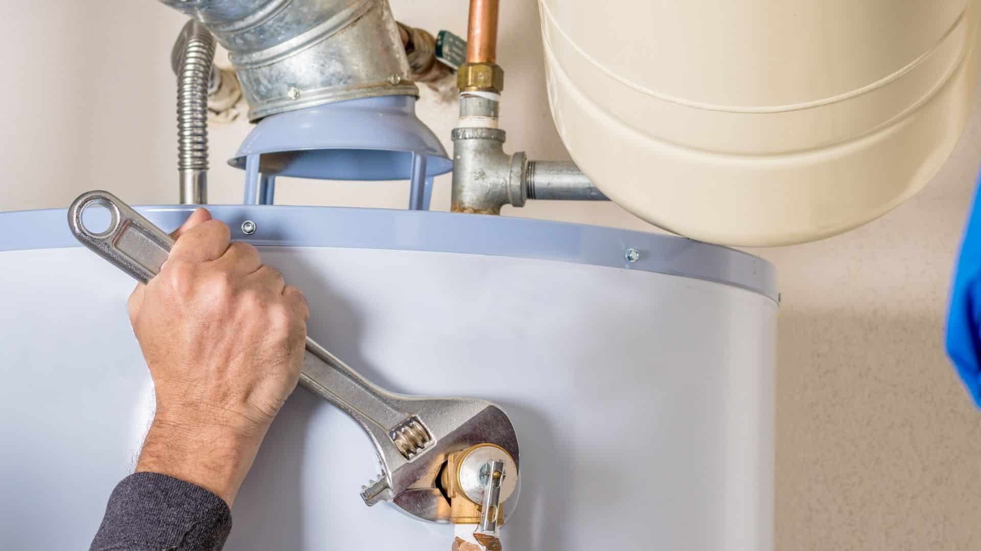 Plumber working on water heater